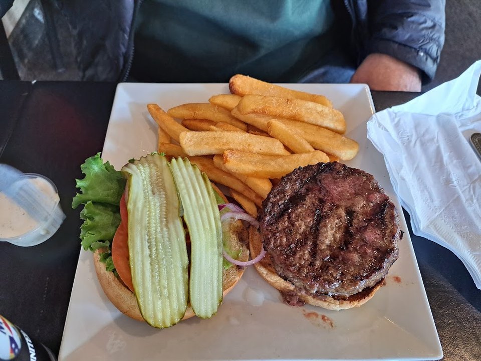 Pub menu featuring pies and burgers.