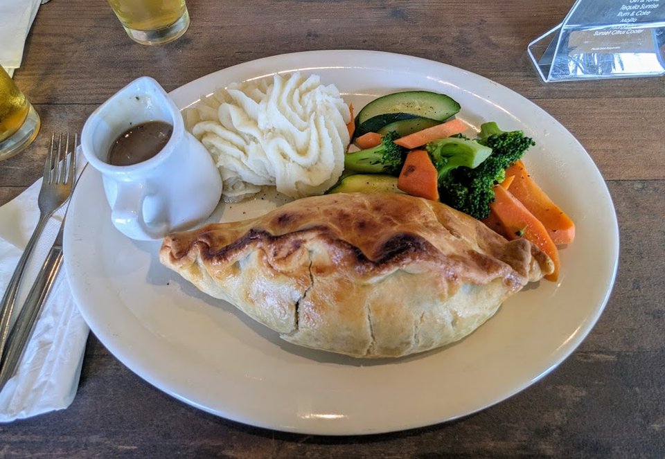 Printed menu with fish and chips.