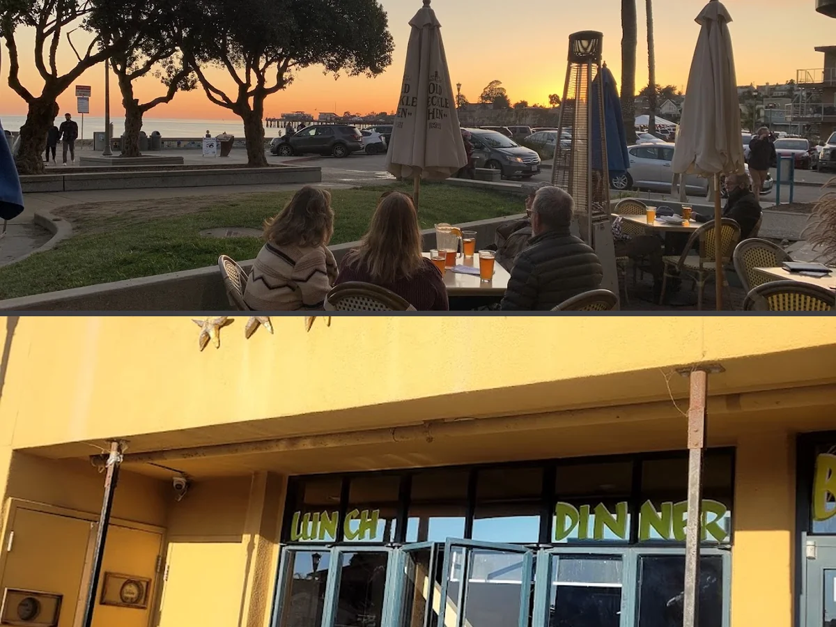 Pub tables beside ocean-view windows.